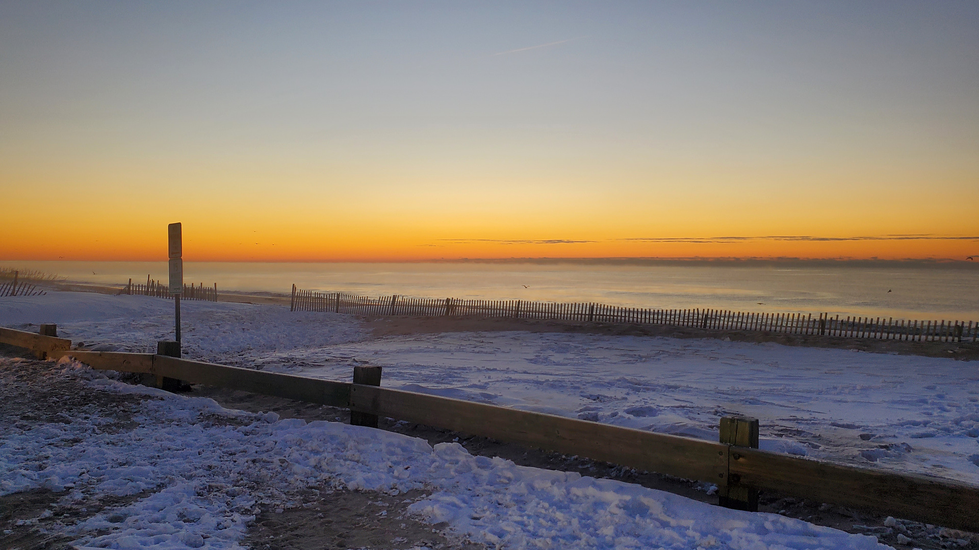 Snow on the dunes at Main Beach in East Hampton at sunset