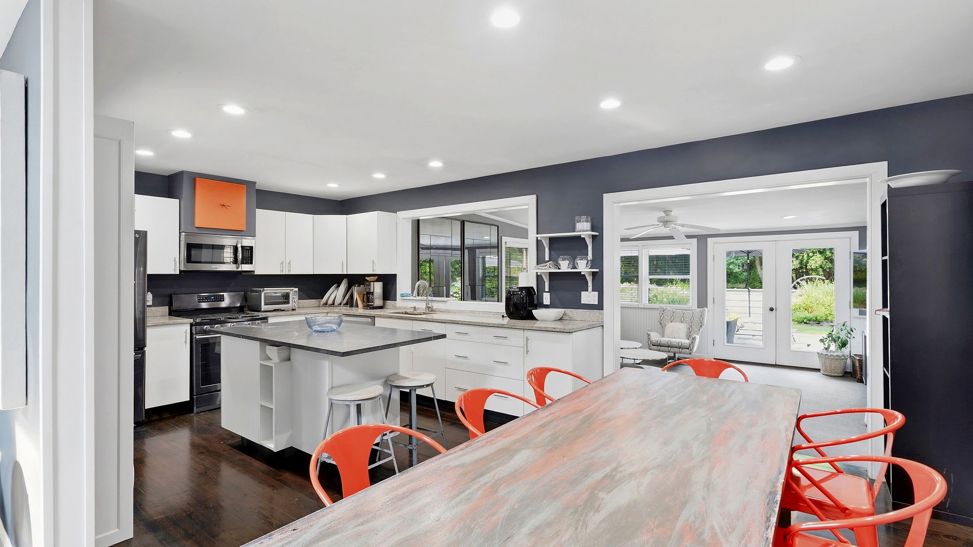 Kitchen and long dining table at the Southampton Pool Home Near Village, Southampton, NY