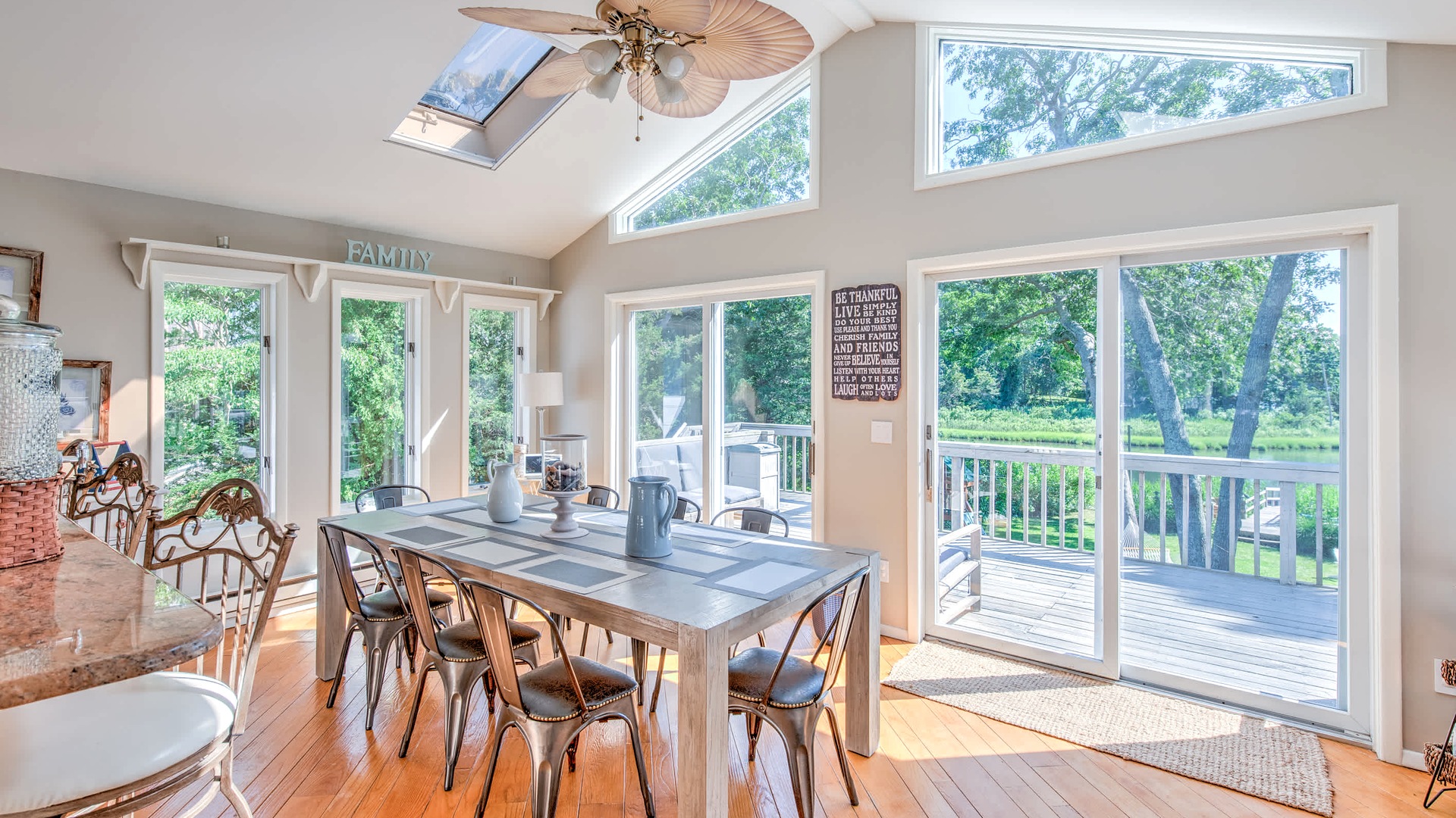 Dining room with water views at Hamptons Water Living on Southampton Cove, NY